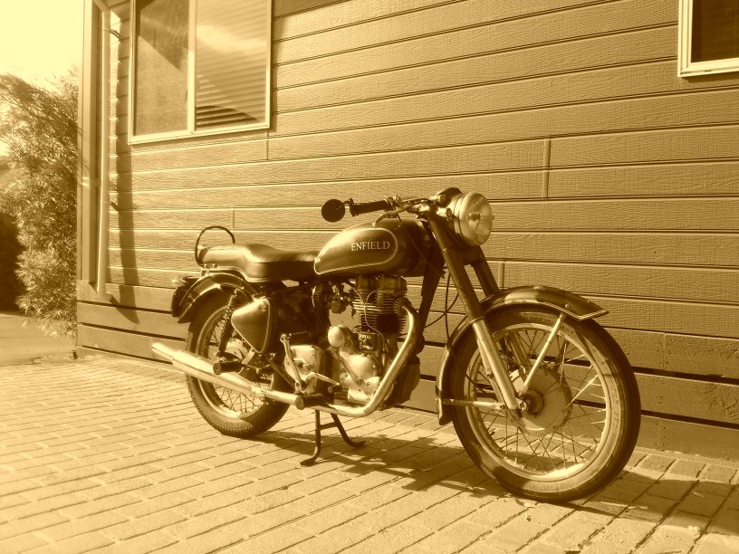 20 October - 71 - Merimbula Beach Resort - Gav's Royal Enfield - sepia phone photo.JPG