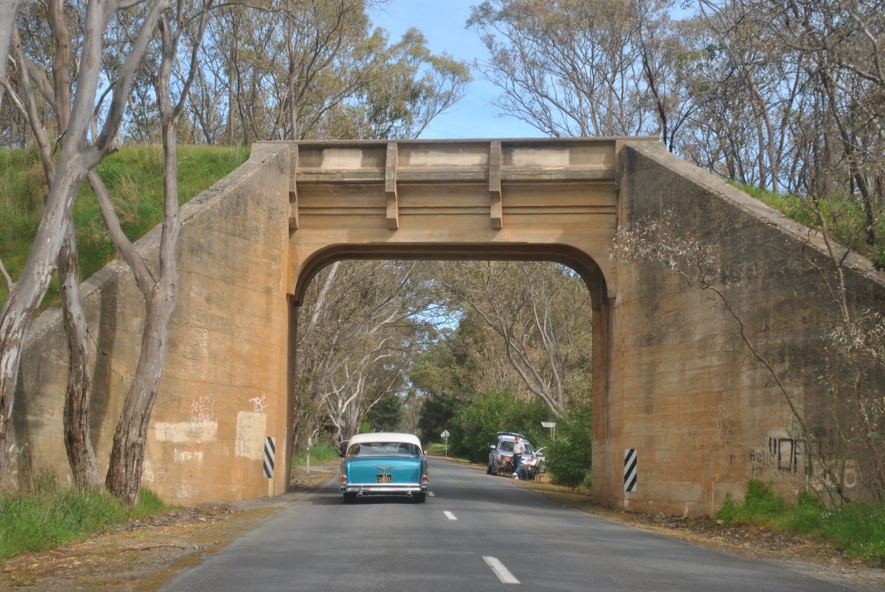 36 - Burford Hill Road - 1957 Chev going under old rail bridge.JPG