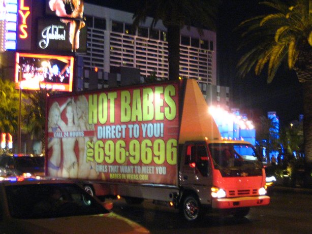 085 - Isuzu truck with Chev badging - and hot babes direct to you sign.JPG