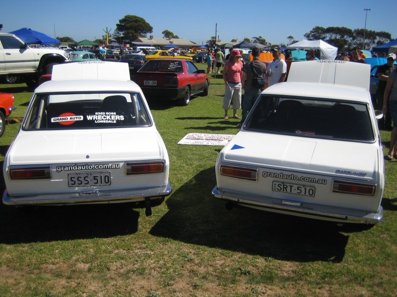 Datsun 1600 sedans next to each other.jpg